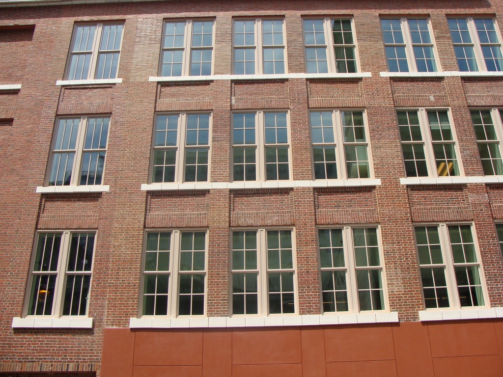 Tuttle Building Annex has a brick exterior with multiple windows on each floor.
