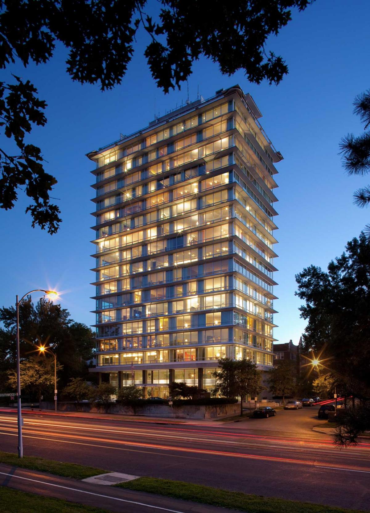 This tall, multi-story building has window walls from the top to the bottom of the structure.