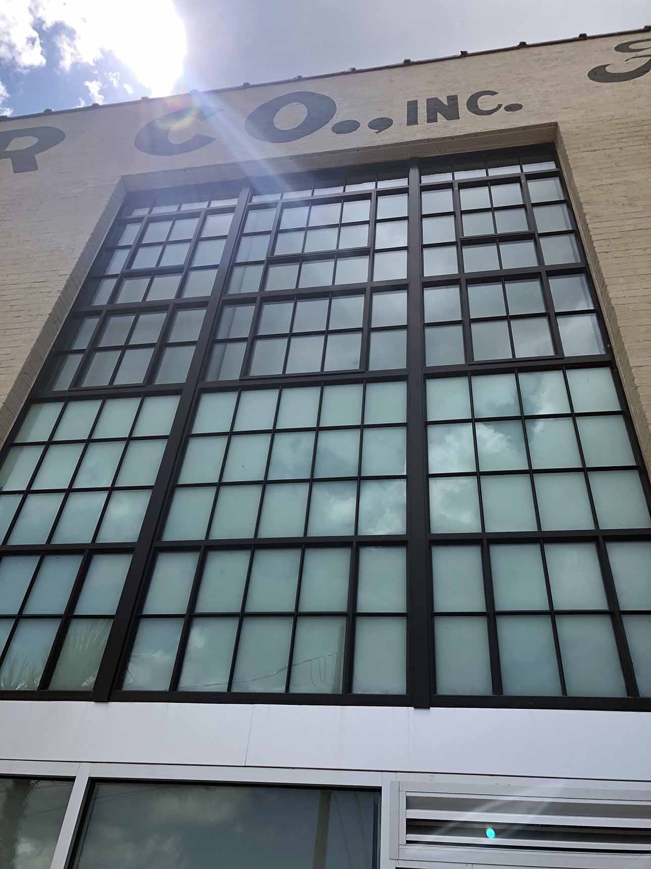 Close up of window wall and sky in background