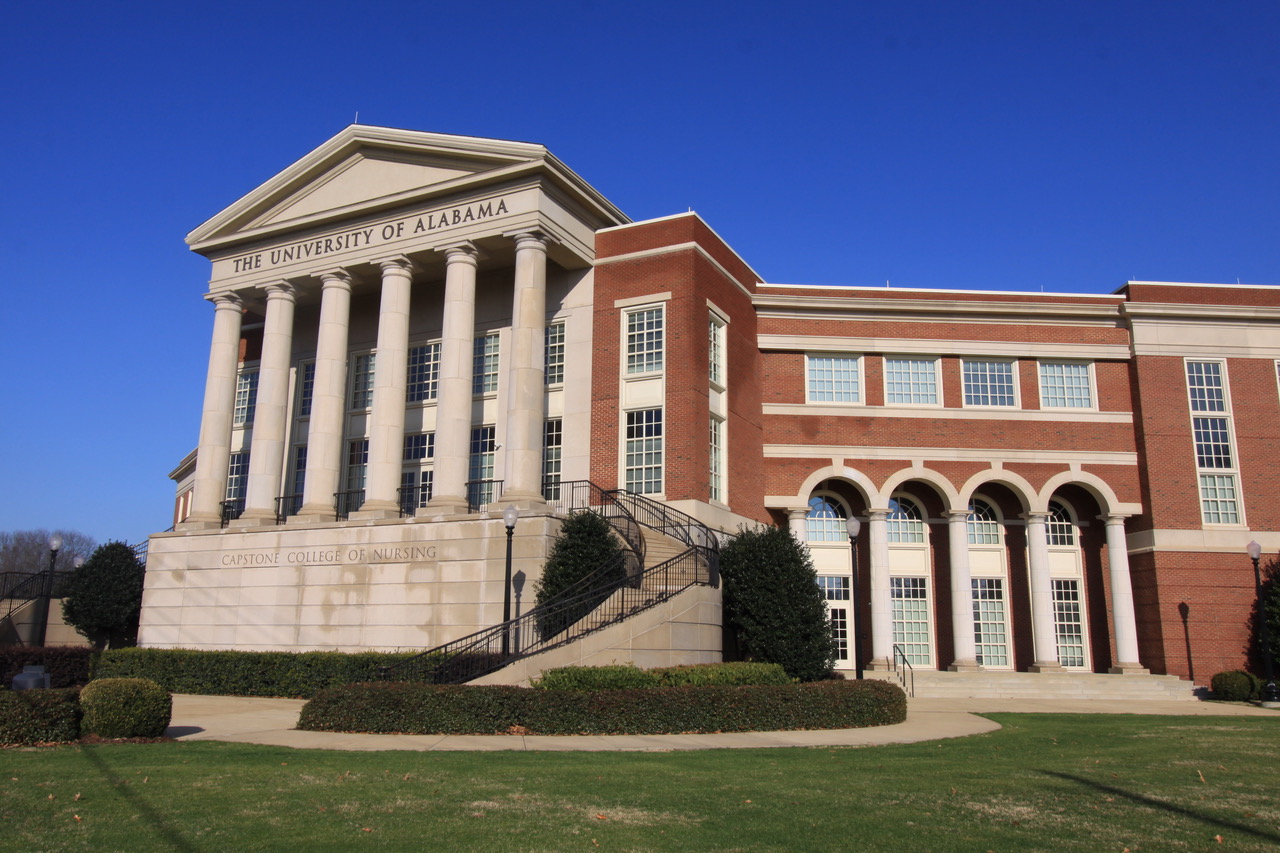 University of Alabama style with red brick exteriors, limestone trim, and plenty of large, single hung windows.
