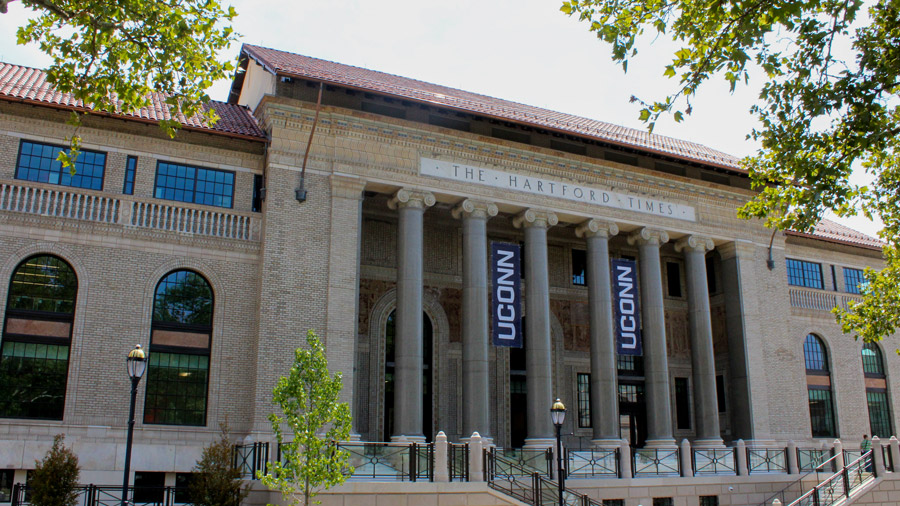 A large building featuring columns and a clock tower, showcasing Winco's energy-efficient, noise-reducing windows.