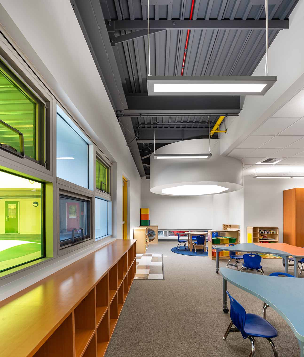 Large interior school classroom with desks 