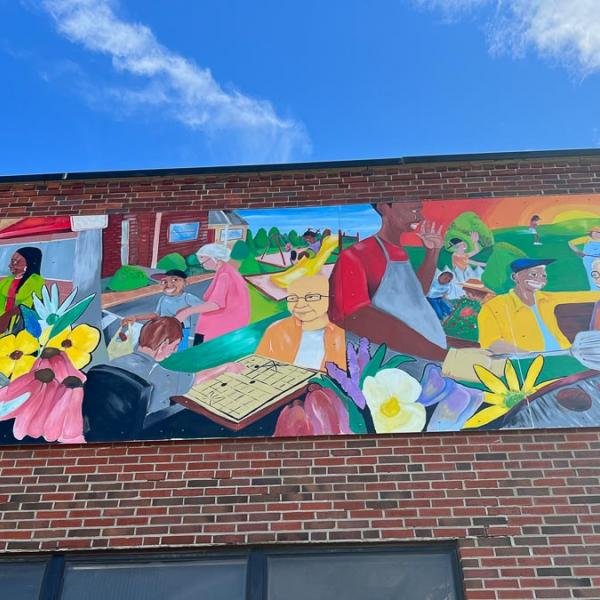  custom mural celebrating daily life and diversity in the community
