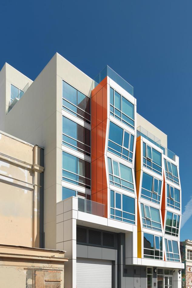 Vida Condos showcases a large, colorful facade with numerous windows, designed for ventilation and unobstructed street views.