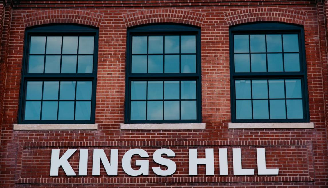 Kings Hill featuring Winco's 1150S series windows finished with black Kynar paint, include a black spacer and muntins to replicate the original windows.