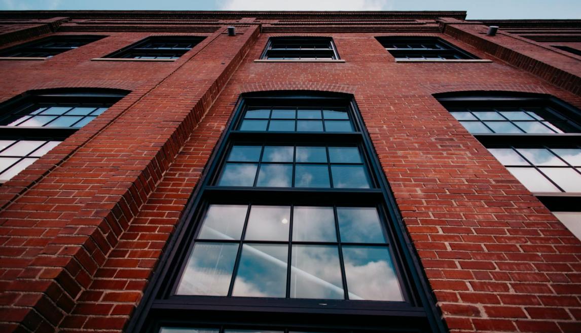 Kings Hill featuring Winco's 1150S series windows finished with black Kynar paint, include a black spacer and muntins to replicate the original windows.
