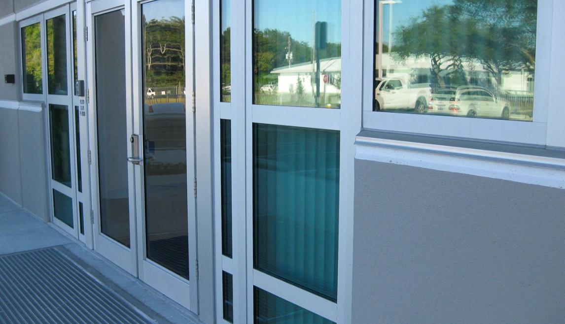 The Public Works Emergency Responders Building (PWERB) is a two-level building that holds a LEED Gold Certification and features Winco tornado-rated windows. Close-up of a building, featuring a tornado resistant window.
