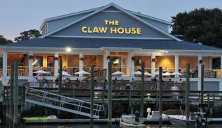 Front of Claw House Restaurant_boats and dock in front of building